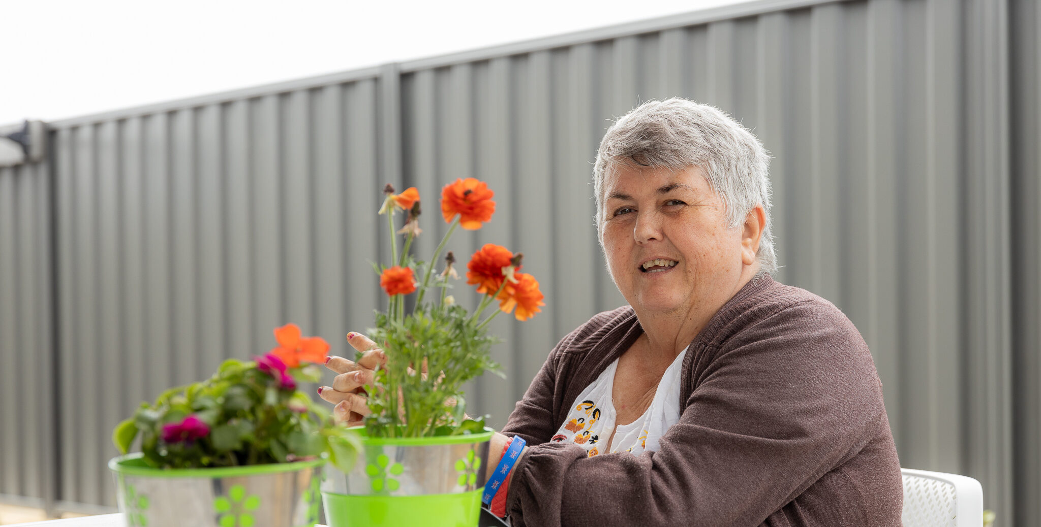 Interchange WA Customer near a bed of roses